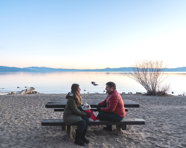 weird facts about Lake Tahoe couple sitting on tahoe beach