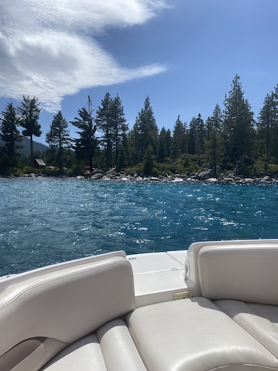 summer activities Lake Tahoe photo of lake tahoe blue water from the edge of a boat